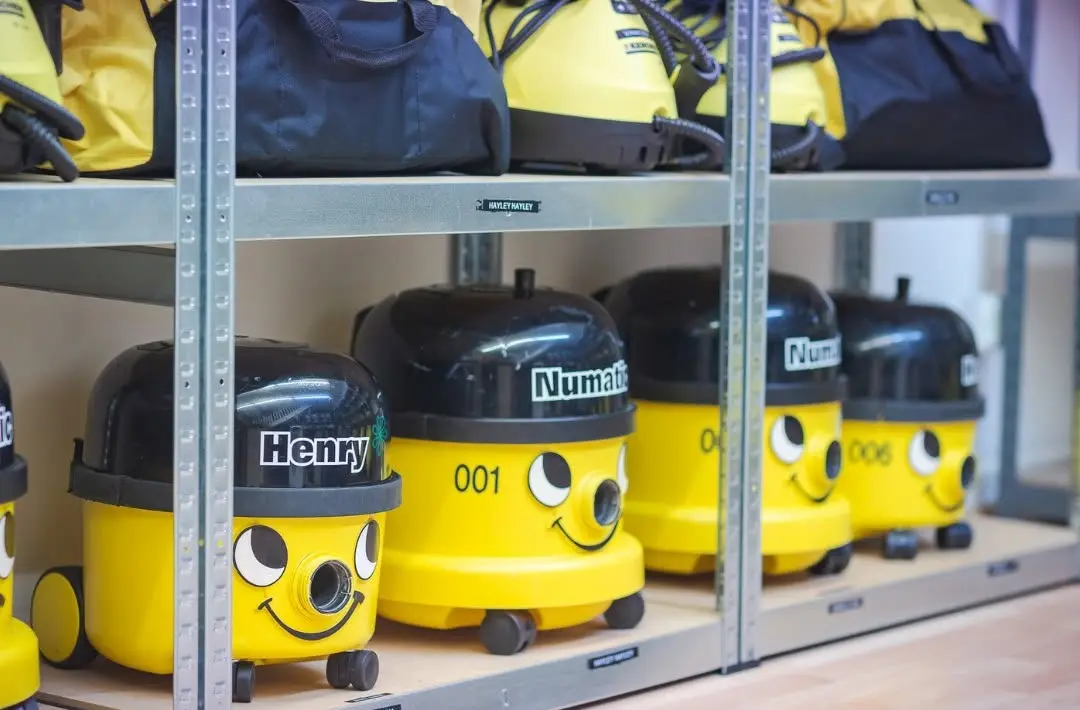 Clean Bees branded Henry vacuums lined up in The Hive